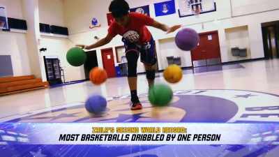 AND THE SECOND ONE IS FOR MOST
BASKETBALLS DRIBBLED BY - Harlem Globetrotters: Play It Forward