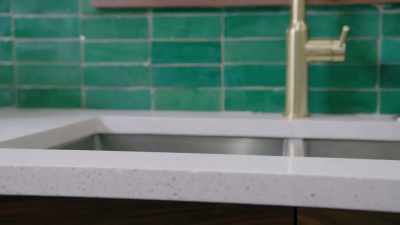 And we were able
to put down this awesome
quartz countertop. - Renovation Impossible