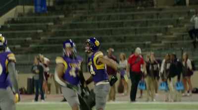 ANNOUNCER [over speaker]:
Back deep for your Karr Cougars, - Algiers, America