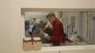 Another is taken
to an operating room. - 20 Days in Mariupol