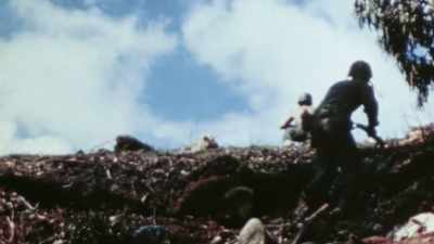 ANOTHER UNIT HAD SCRAMBLED UP
THE BACK SIDE OF CHONITO RIDGE - The Pacific War in Color