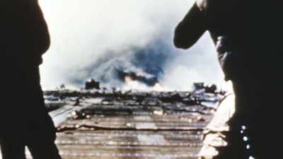 ARCHIVAL NARRATOR: The
flag flies at half staff - The Pacific War in Color