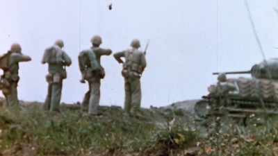 As dead and
wounded are carried off, - The Pacific War in Color