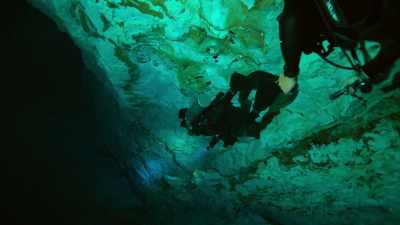 As we dive down,
the light quickly fades - Lost Treasures of the Maya