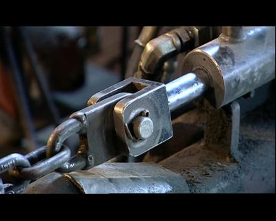 AS THE CLAMP HOLDS
THE FLIGHTING IN POSITION, - How It's Made