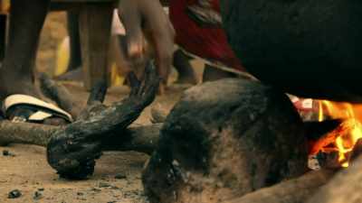 AS THE VILLAGERS
PREPARE A MEAL - Expedition Mungo