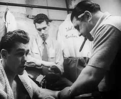 At 8 o'clock in the
small hot dressing room - Day of the Fight