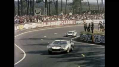 At the esses,
the seven-liter Ford GTs - Shelby American
