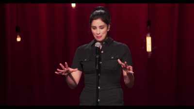 - [audience laughing]
- But, um... [chuckles] - Sarah Silverman: A Speck of Dust