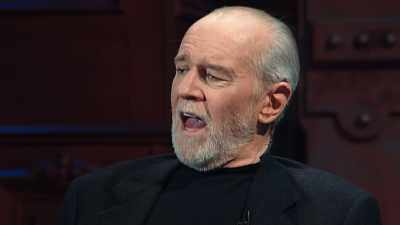 -(AUDIENCE LAUGHING)
-...you know, and armbands, - George Carlin's American Dream