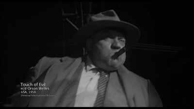 Belly first,
then looming above the camera, - The Eyes of Orson Welles
