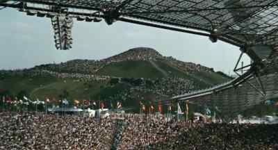 Beyond the stadium
and the thousands clustered on the hill, - Visions of Eight