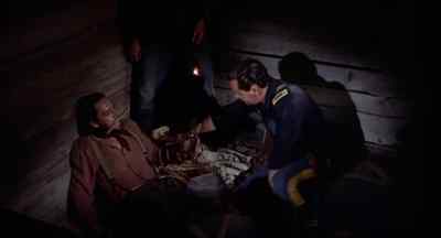 Bite this. Give me a hand here.
Pull him down and hold him down. - The Horse Soldiers