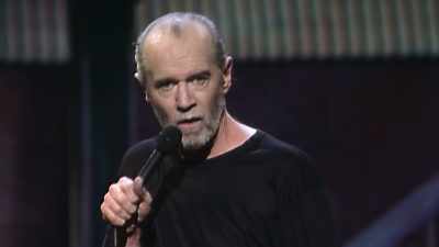 -(BLOWS)
-(AUDIENCE LAUGHING) - George Carlin's American Dream