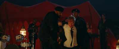 Both grunting Get off me Do you know who I am - Red Notice