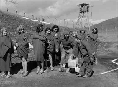 [BOTH SINGING INDISTINCTLY
AND WOMEN LAUGHING] - Stalag 17