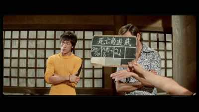 'Bruce and James Tien
watch at the sidelines, - The Final Game of Death