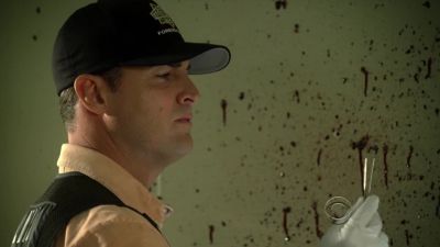 Bullet... looks like a nine mill.
Hmm. - CSI: Crime Scene Investigation