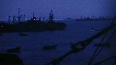 But in these pre-dawn
waters, it's only beginning. - The Pacific War in Color