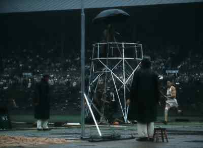 But the final round is coming up,
rain or no. - XIVth Olympiad: The Glory of Sport