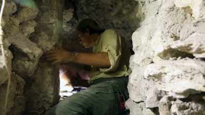 But then in a shallow pit... - Lost Treasures of the Maya