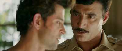 By placing Amit's handkerchief
on Wasim's shoulder - Kaabil
