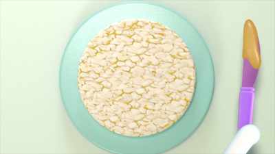 [Cakey] Step one: Cover your rice cake
with sunflower butter. - Gabby's Dollhouse