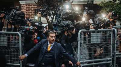 [CAMERA SHUTTER CLICKS] - The Dissident