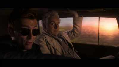 - [CAR HORN HONKING]
- [TYRES SKID] - Good Omens