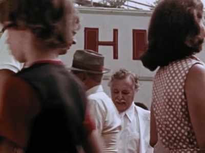 [ Carnival music playing, man
speaking indistinctly on P.A. ] - The Amusement Park