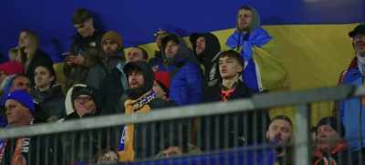 [chanting loudly] - Football Must Go On