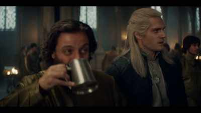 - [cheering]
- [band strikes up] - The Witcher