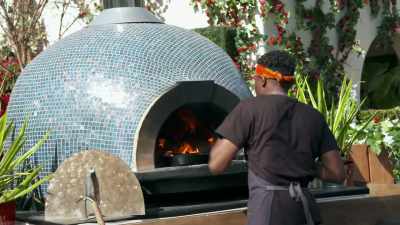 Chef Martel has his
stuff in the pizza oven. - Chopped Next Gen