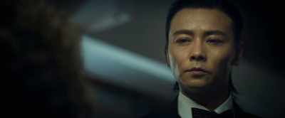 Chinese, with a briefcase
and an umbrella. - Escape Plan: The Extractors