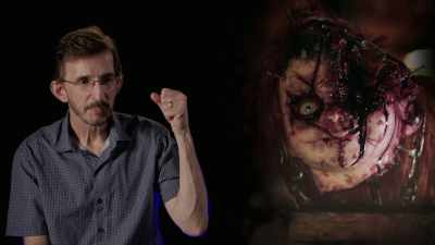 -Chucky sticks his arm
into her throat - Doc of Chucky
