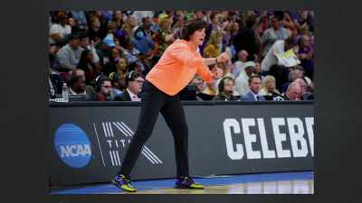Coach Katie Meier was suspended
for three games at the start - Impact x Nightline