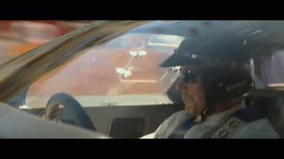 COMMENTATOR: Ken Miles, Ford, has set a new lap record. - Ford v Ferrari