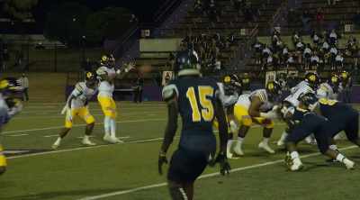 COMMENTATOR:
Samuel takes the snap, retreats to throw. - Algiers, America