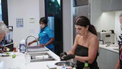 Cooking and sitting
at the dinner table together-- - The Real Housewives Ultimate Girls Trip