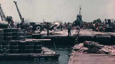 COUNTLESS BOXES CAN NOW MOVE
FROM SAIPAN TO TINIAN - The Pacific War in Color