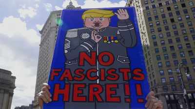 CROWD (chanting):
No Trump! No fascist USA! - Trump Card