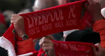 [CROWD CHANTS]:
♪ You'll never walk alone ♪ - The End of the Storm