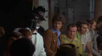 [crowd chattering] - Hit Man