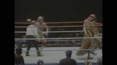 -[crowd cheering]
-[commentator speaks indistinctly] - Mr. McMahon
