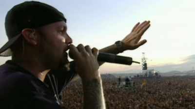 -(CROWD CHEERING)
-(DRUM BEATING) - Woodstock 99: Peace Love and Rage