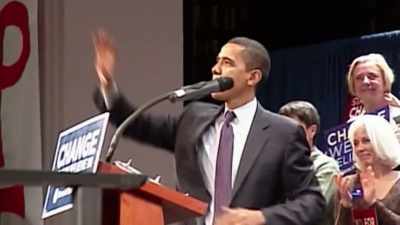 -(CROWD CHEERING)
-REPORTER 2:
In his stump speech, - Obama: In Pursuit of a More Perfect Union