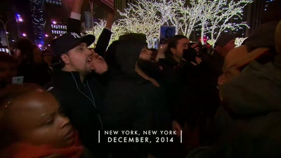CROWD: I can't breathe!
REPORTER: It would seem to be - Sound of the Police