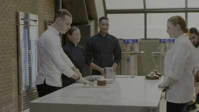 -[curious music playing]
-German cake, straight from America. - School of Chocolate