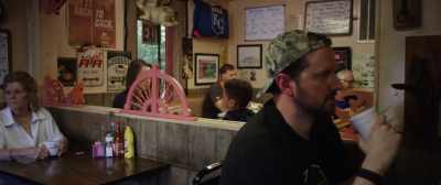 (customers chattering)
(upbeat country music) - They Wait in the Dark