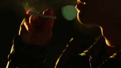 Dark curly hair,
beautiful leather jacket. - Homicide Hunter: Devil in the Mountains